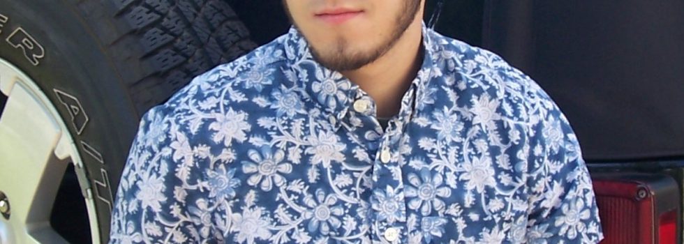 Head Shot Of Mario Aguirre In Front Of A Car