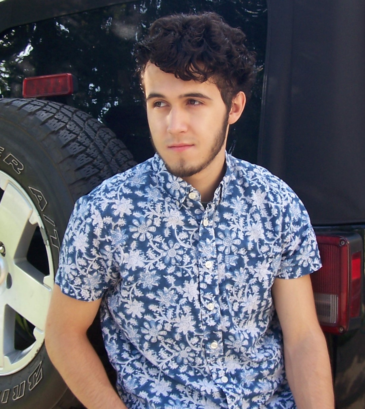 Head Shot Of Mario Aguirre In Front Of A Car