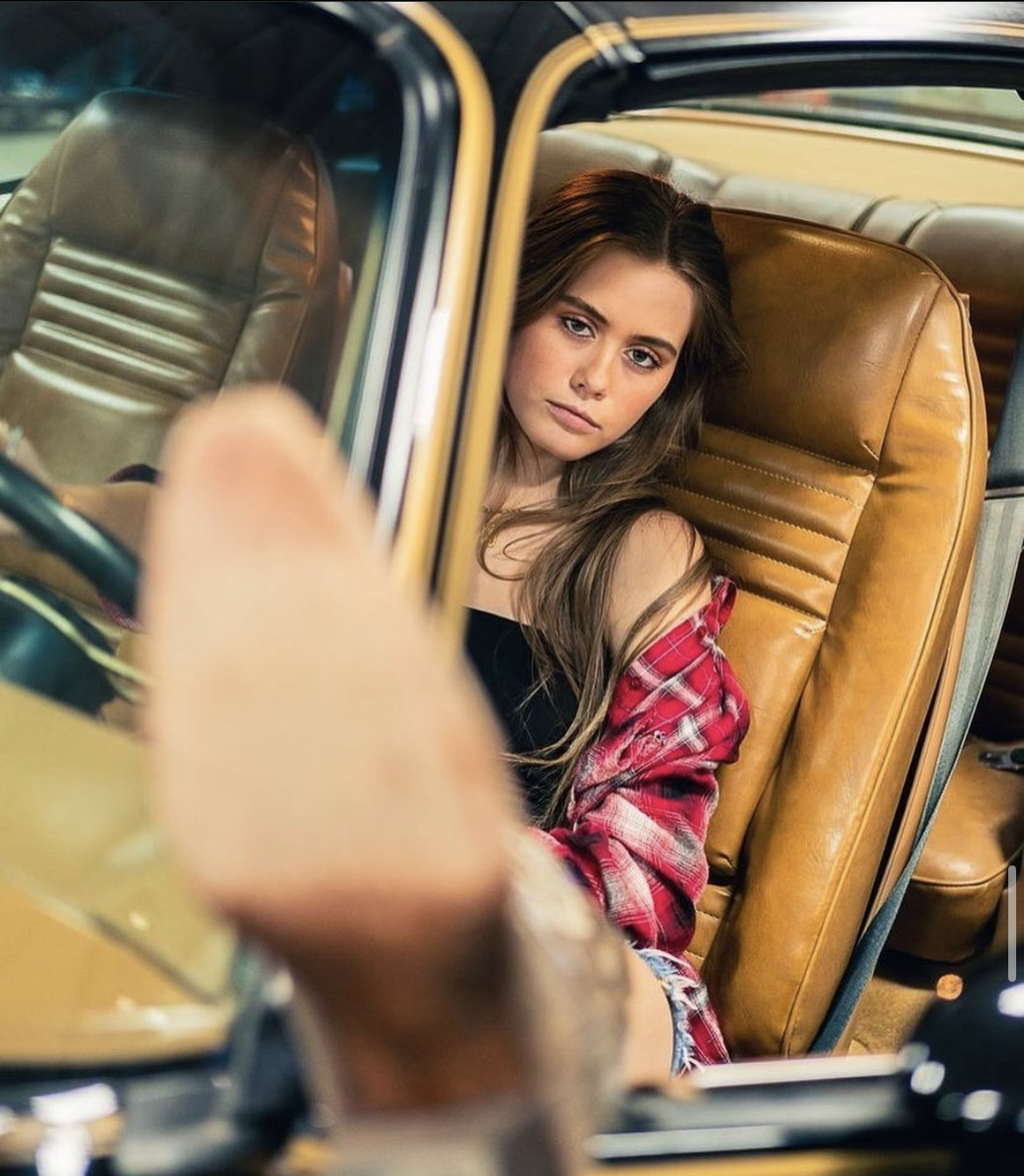 Mackenzie Modeling In A Car With Her Foot Out The Window From The Magazine Feature